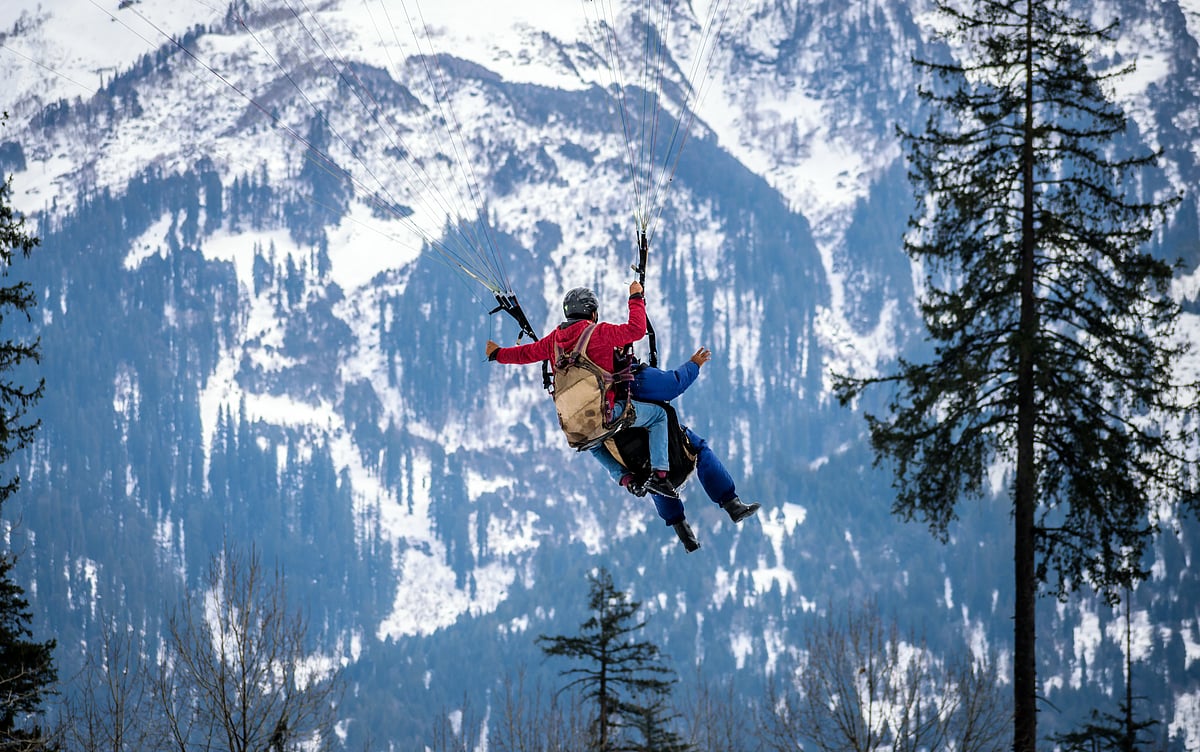 Tandem pilots are responsible for taking one client at a time on an assisted paragliding flight