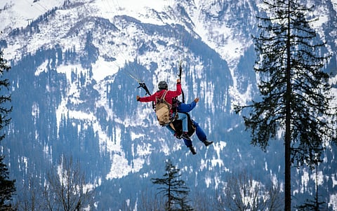 Tandem pilots are responsible for taking one client at a time on an assisted paragliding flight