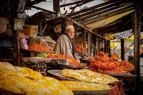 A vendor at his sweet shop/Representational