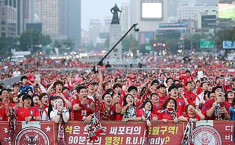 Korean fans cheer on the men's squad during the 2014 FIFA World Cup in Brazil
