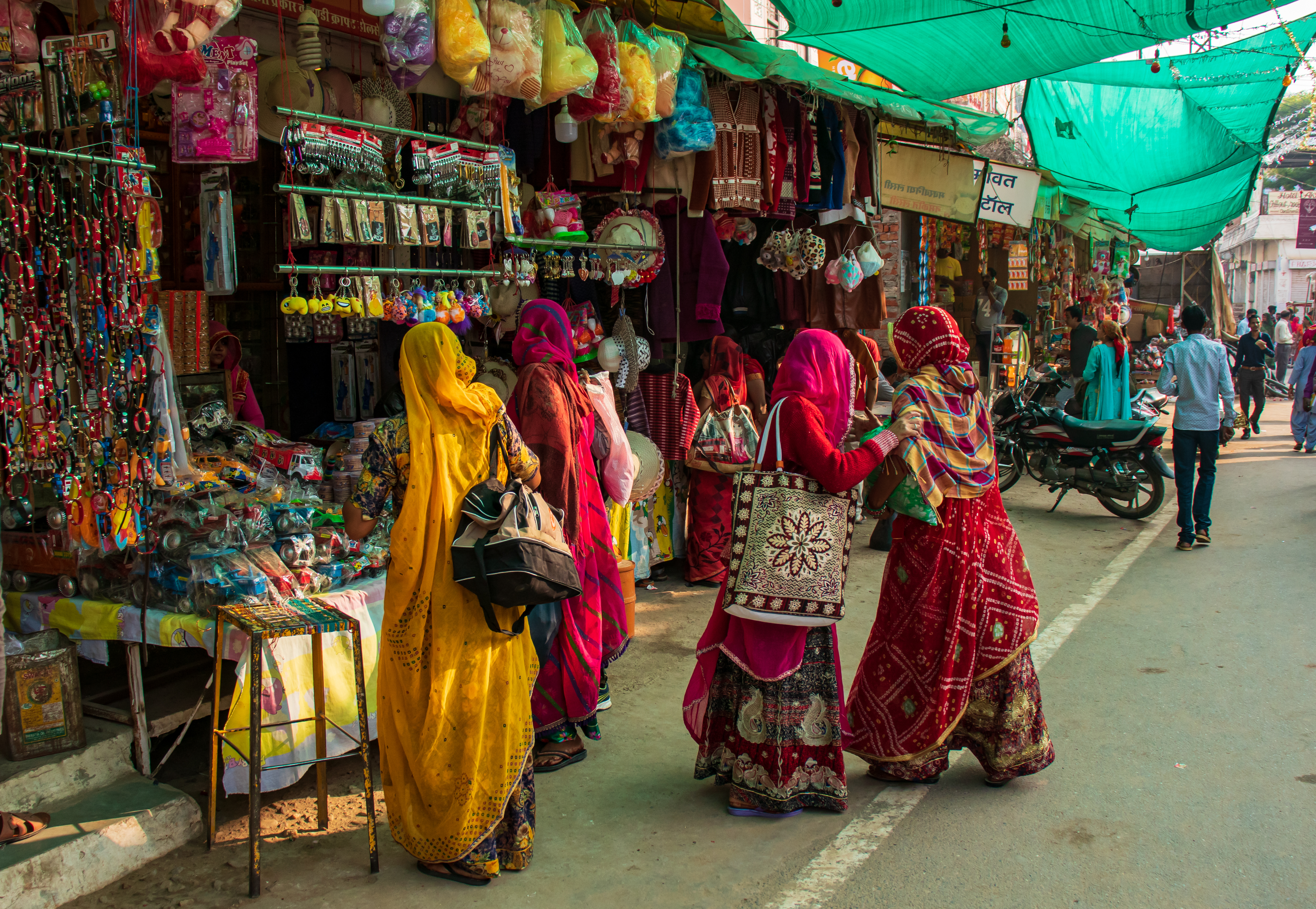 Rajasthani women wearing traditional attire while shopping in the local market