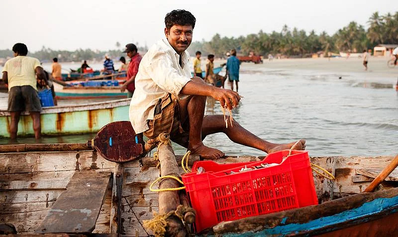 A fisherman unloading his days catch at the beach