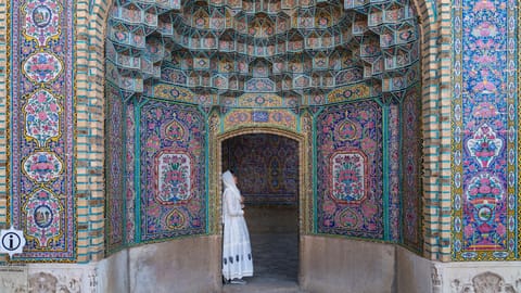 A woman stands at the  Nasir al-Mulk Mosque, Iran
