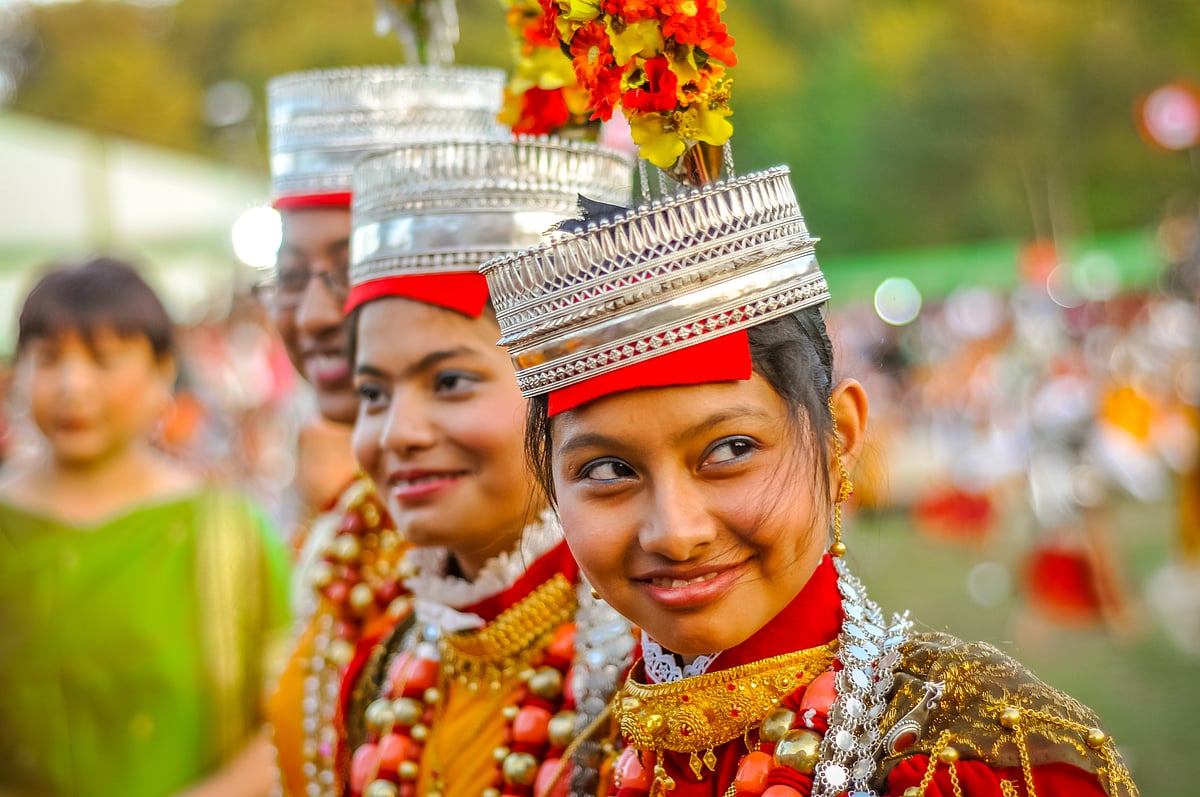Smiling girls in traditional costumes