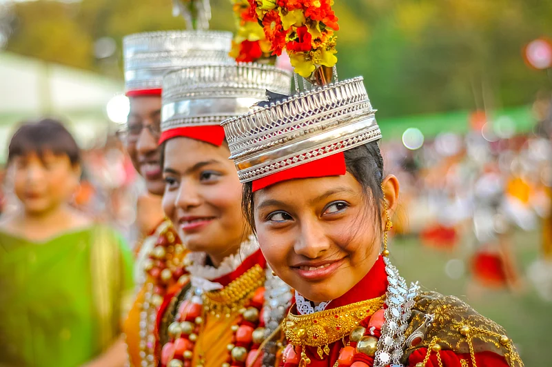 Smiling girls in traditional costumes