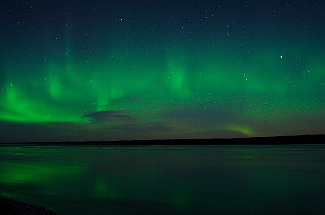 Aurora borealis glowing over Quebec in Canada