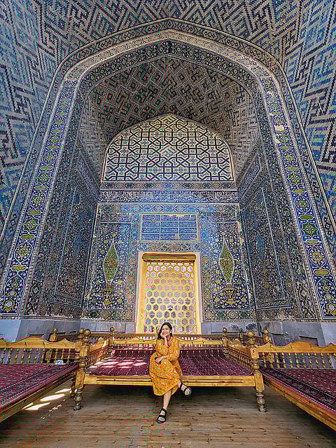 The author resting in the shade of the Ulugh Beg Madrasa on a hot summer day