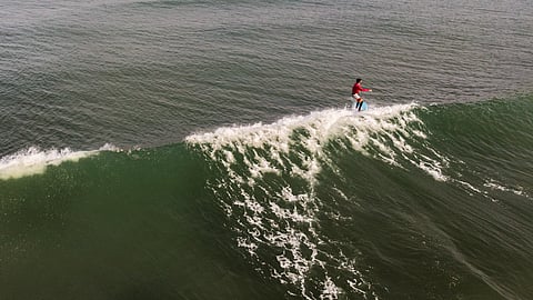 Surfing is a popular water activity at Kovalam Beach
