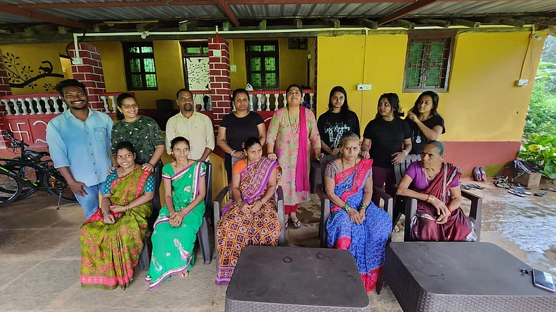 Guests and the homestay staff posing for a photo
