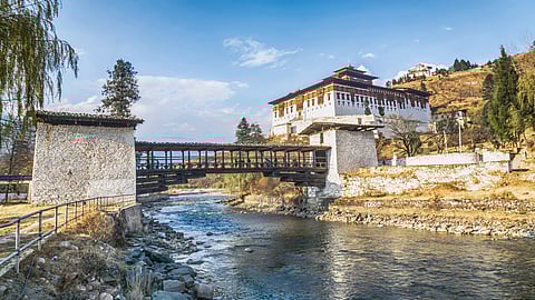 A view from the bridge across the river with traditional Bhutan palace, Paro Rinpung Dzong