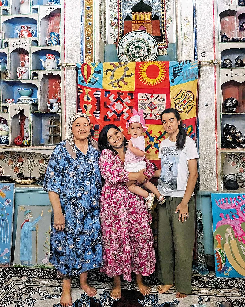 The author, Nabiha Tasnim (centre), with her hosts at UTSO Art House in Bukhara—Umida (left), matriarch of the house, daughter-in-law, Ruxsora, and granddaughter, Behtarin