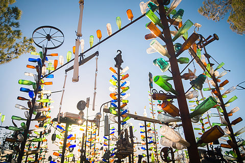 Art installation with collected beer bottle at Elmer's Bottle Tree Ranch