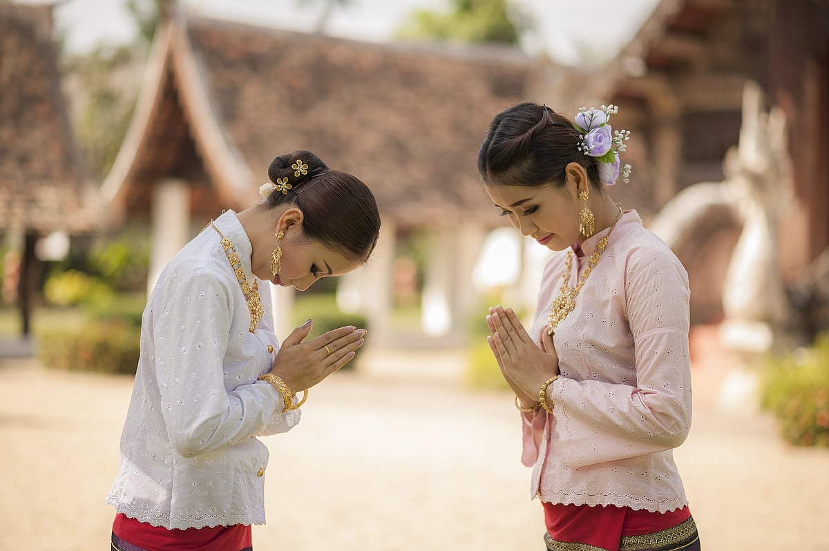 The wai involves bringing your palms together, bowing your head and slightly bending your body 