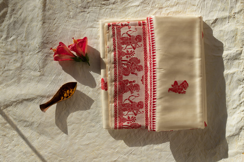 Baluchari saris feature intricate designs inspired by characters and stories from Ramayana and Mahabharata