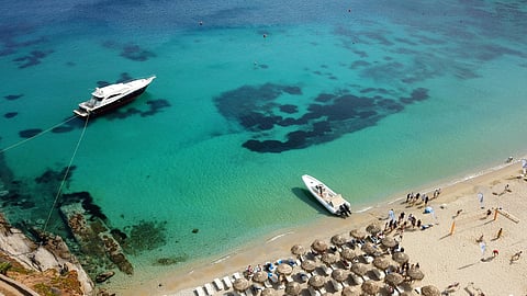 An aerial view of Psarou Beach