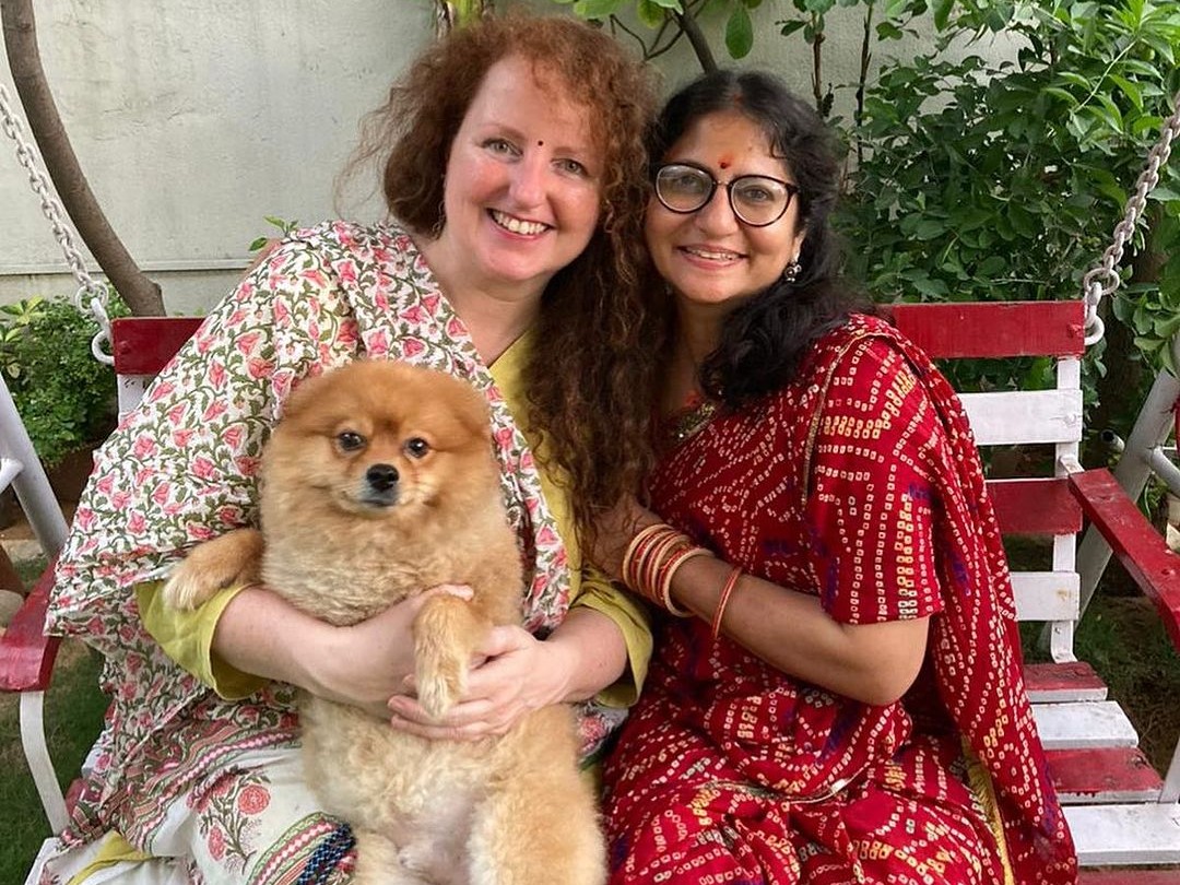 Jyoti Chaturvedi (in red suit) with a guest at her homestay