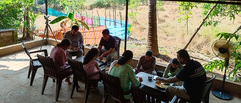 Guests enjoying a meal at the homestay