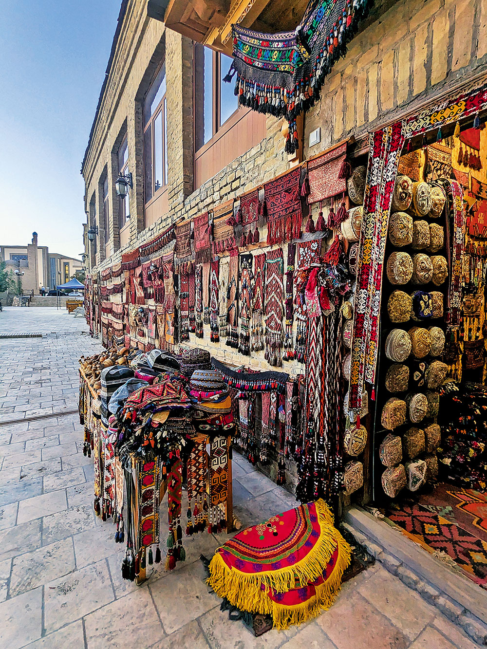 Hand-embroidered caps on display at Taqi Telpakfurushon in Bukhara