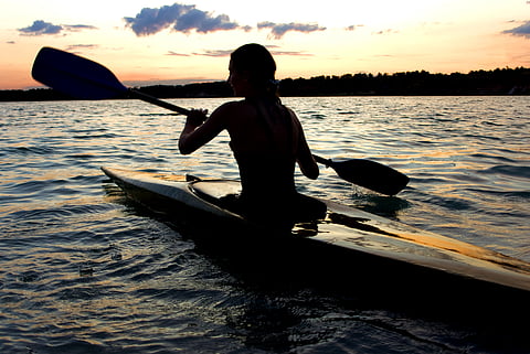 Kayaking requires a double-bladed paddle and usually fits only one person
