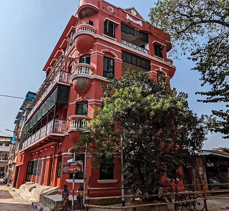 The striking red structure has several beautiful balconies