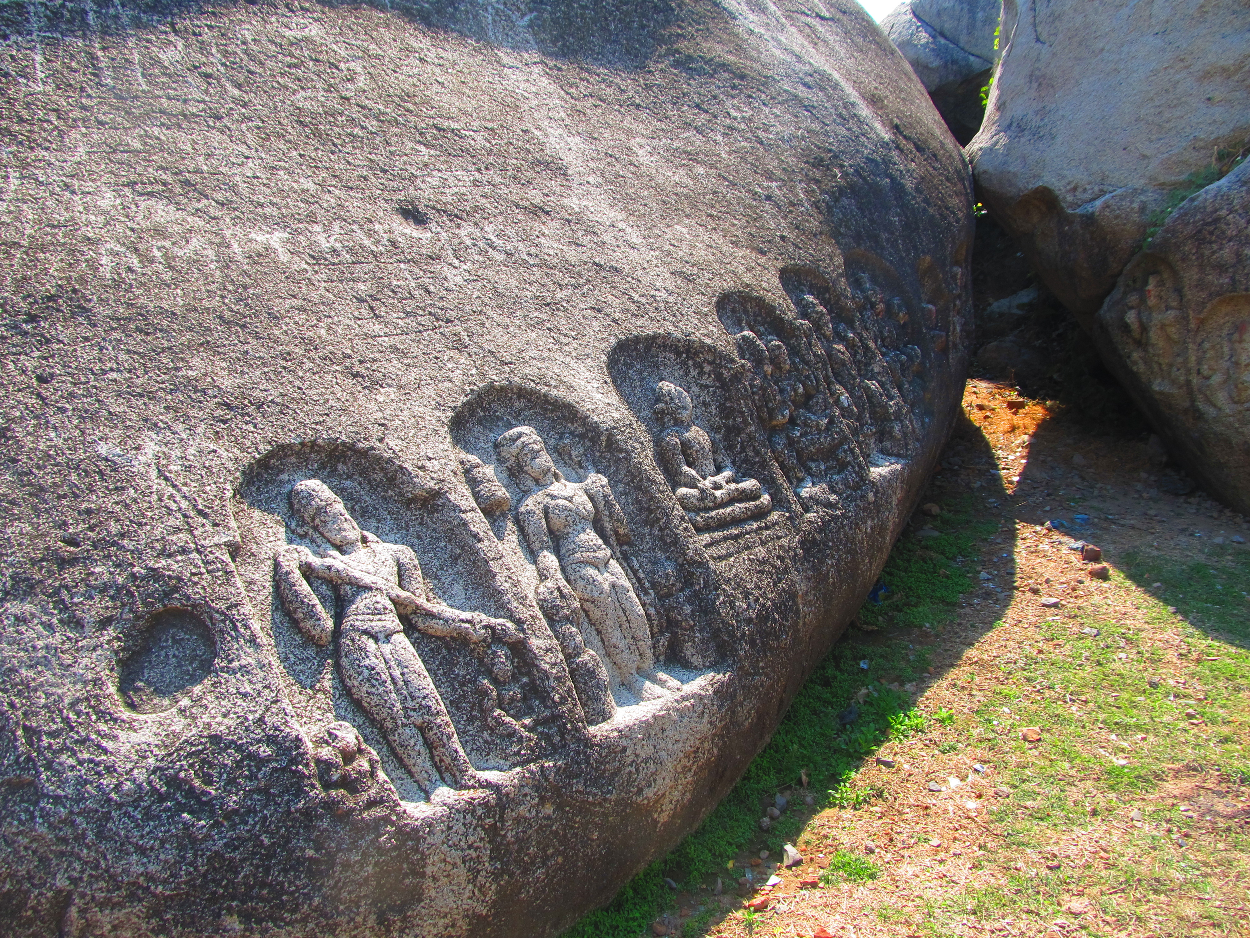 Carved icons at the base of the Kauwa Dol hill