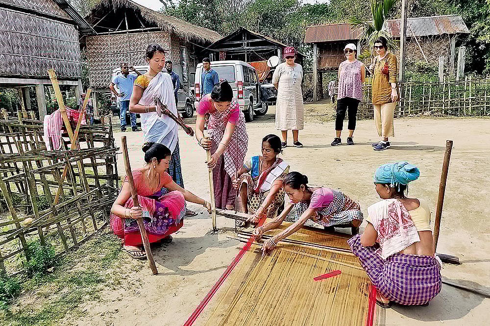 Local weavers using traditional weaving methods in Majuli