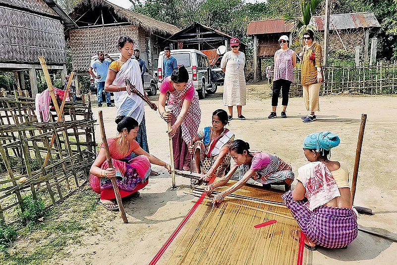 Local weavers using traditional weaving methods in Majuli