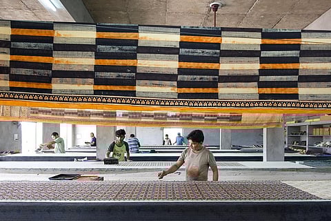 Block printers in an ajrakh workshop in Ajrakhpur