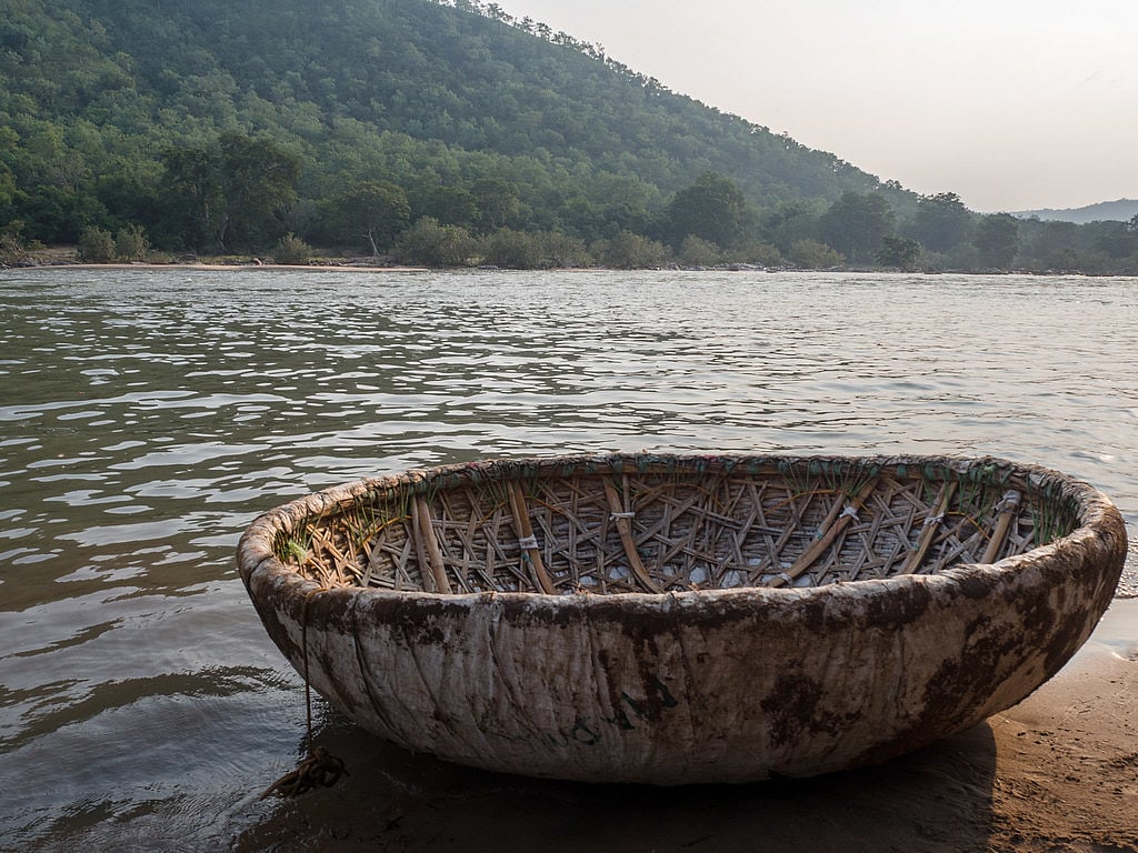 A coracle parked on the riverside