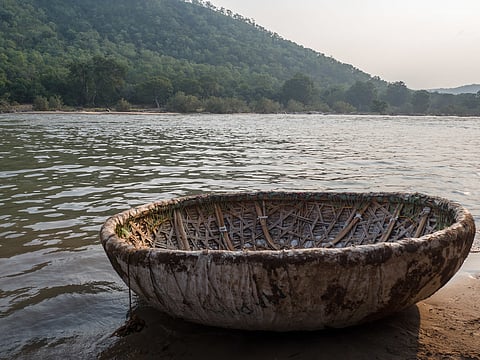 A coracle parked on the riverside