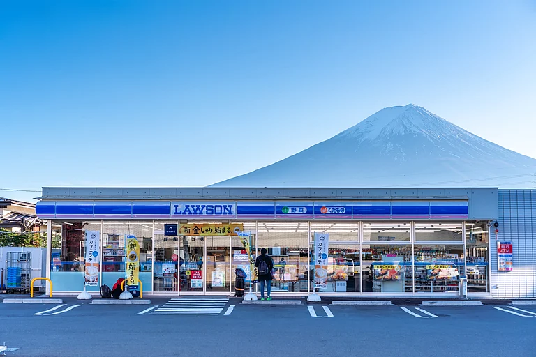 Mount Fuji photographed from behind a Lawson convenience store - YAO23/Shutterstock.com