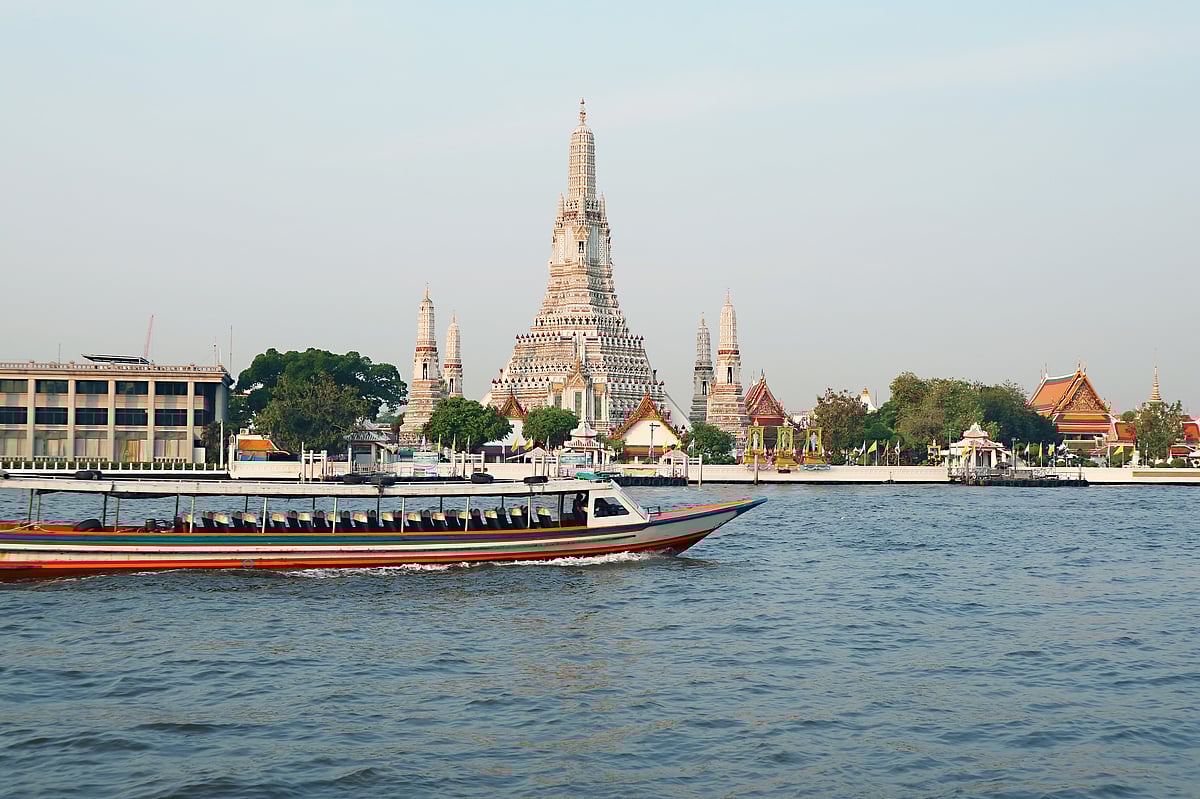 The iconic Temple of Dawn or Wat Arun with the famous Chao Phraya River 