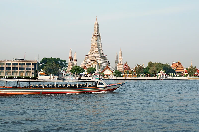 The iconic Temple of Dawn or Wat Arun with the famous Chao Phraya River