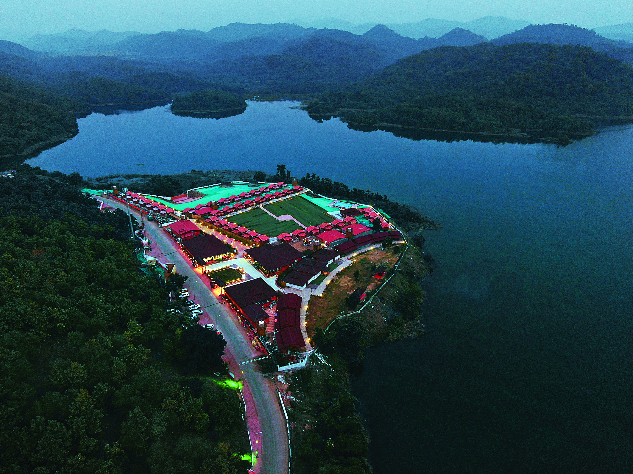 Experience the breathtaking aerial view of Statue of Unity Tent City 1 illuminated at night.