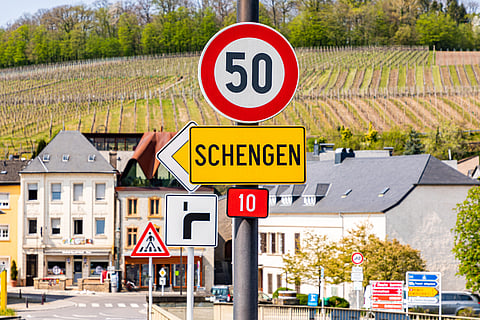 Road sign for Schengen town on the western bank of the river Moselle, Luxembourg, the birthplace of the Schengen Agreement 