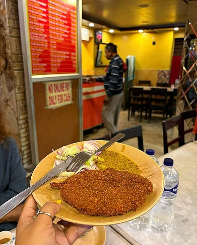 @foodiebongsomrrita/Instagram : The famed cutlets of Dilkhusha Cabin served with some salad and kasundi, the Bangla mustard sauce