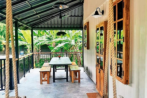 The couple converted two shipping containers into guesthouses, with running balconies