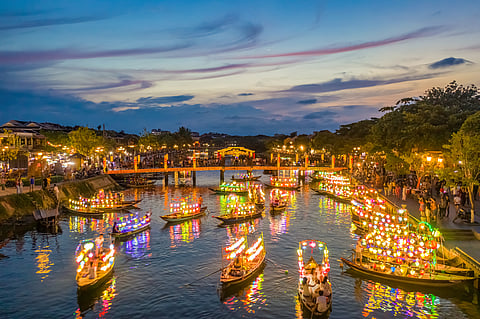 Boats in the night on the Thu Bồn river