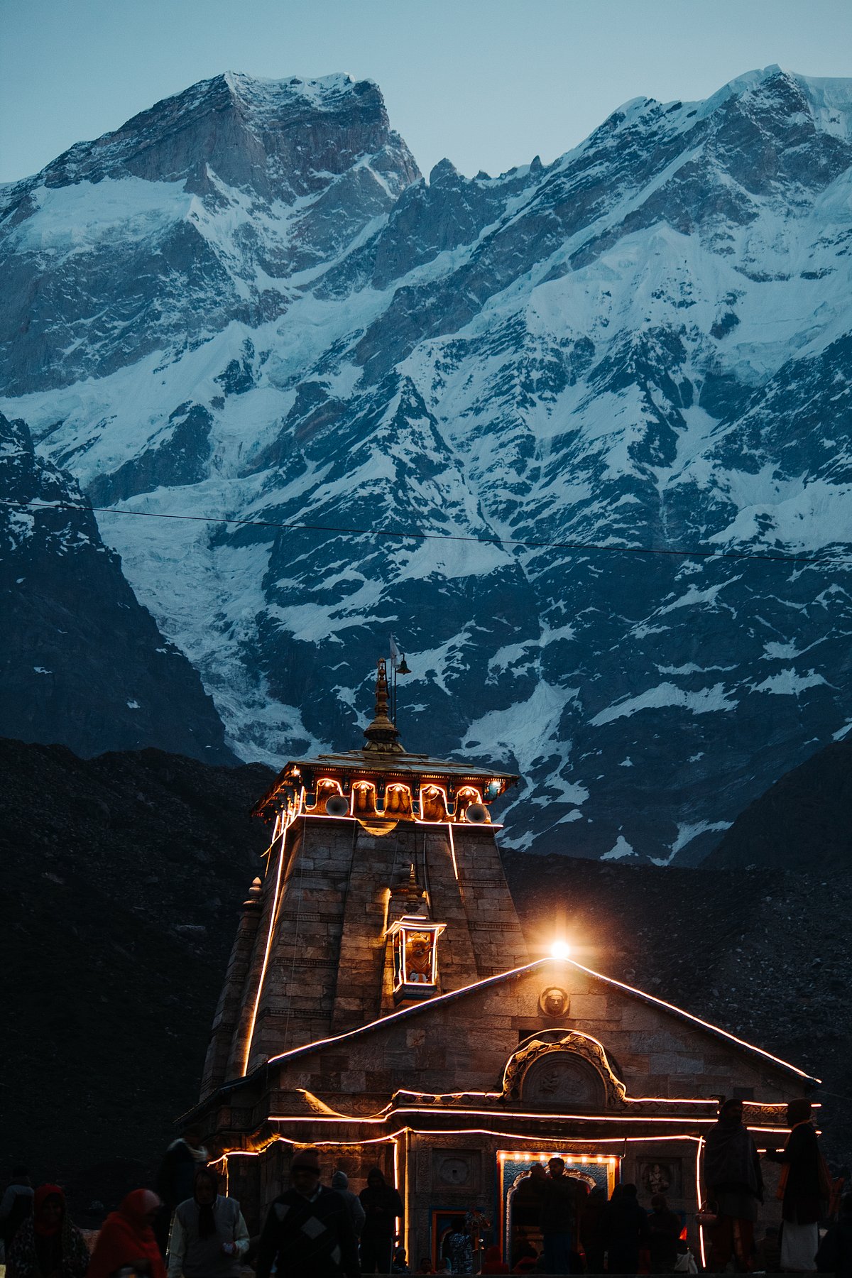 Shutterstock : Kedarnath temple lights at night with mountains in the background in Uttarakhand