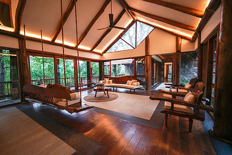 Estate Paathri makes abundant use of natural light with sweeping views of the trees and vegetation outside