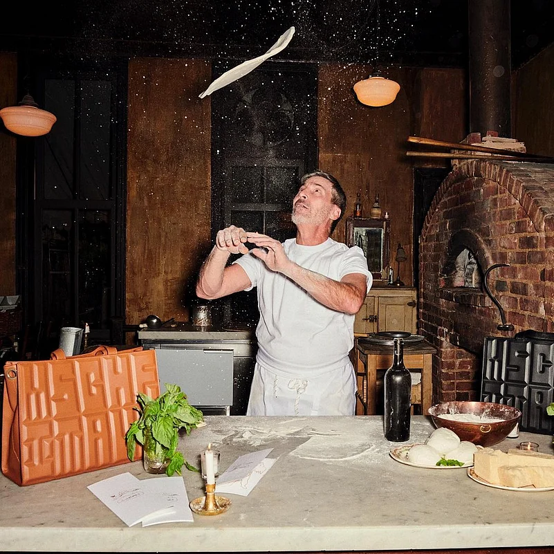 Mark Iacono does a pizza base flip at his restaurant