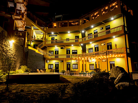 The bright exterior of The Hosteller Rishikesh