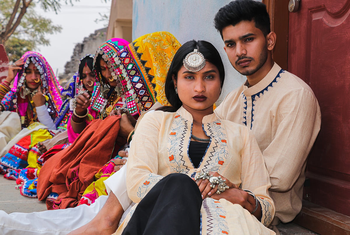 The model in the centre is wearing a cotton kadhi with Lambani thread work. The male model is wearing a charaka cotton kurta