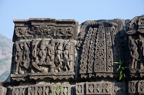A view of rock carvings on the outer wall of Kukdeshwar Temple near Chavand Fort