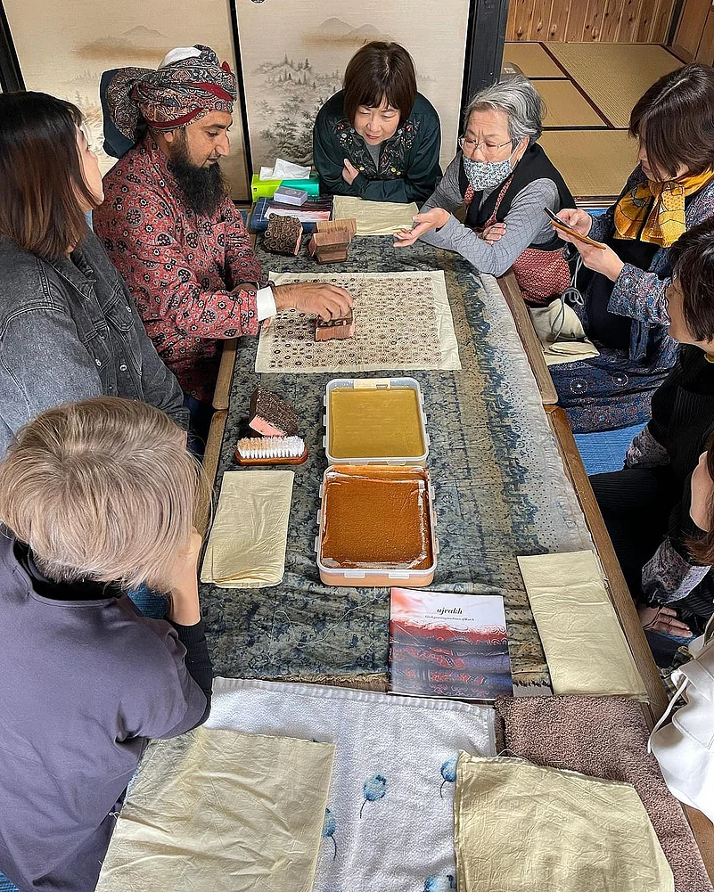 Mater craftsman Sufiyan Khatri holds an Ajrakh block print workshop in Hiroshima, Japan