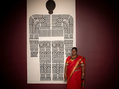 University of Sydney : Mangala Bai Maravi standing alongside her fifteen-foot-long work displayed at the Chau Chak Wing Museum, University of Sydney