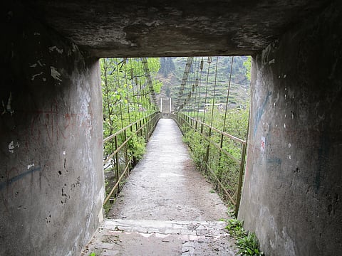 Bridge on the Ganga river from tunnel near Harsil