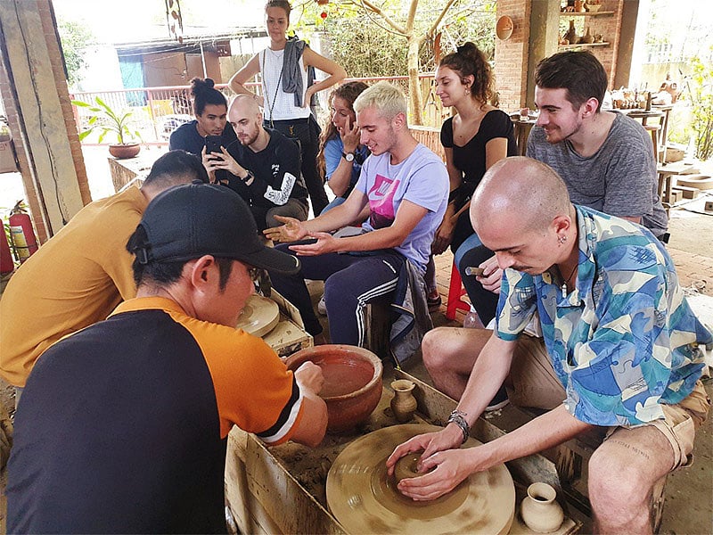 Sitting at the pottery wheel in Thanh Hà Terracotta Park