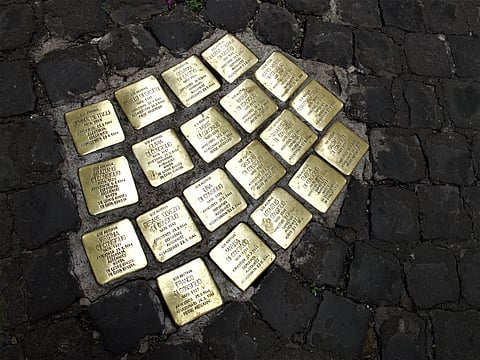 The stumbling stones mark the specific place where victims of the Holocaust lived or worked before being sent to extermination camps
