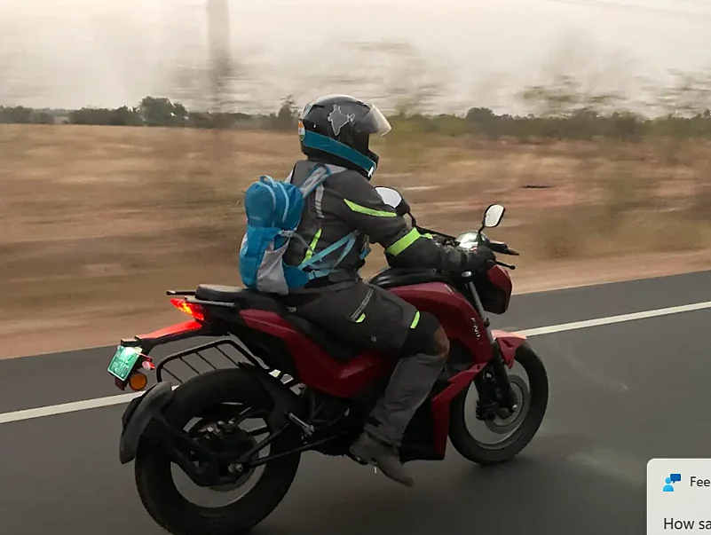 Jai Bharathi, founder of MOWO Social Initiatives leading the campaign on an electric bike